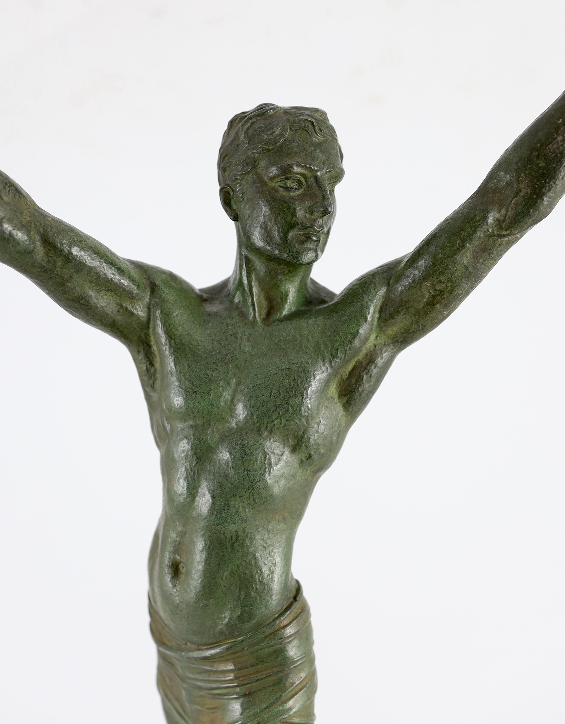 J. Darcourt. NB. An Art Deco patinated spelter figure of a victorious athlete, depth 15cm height 63cm
